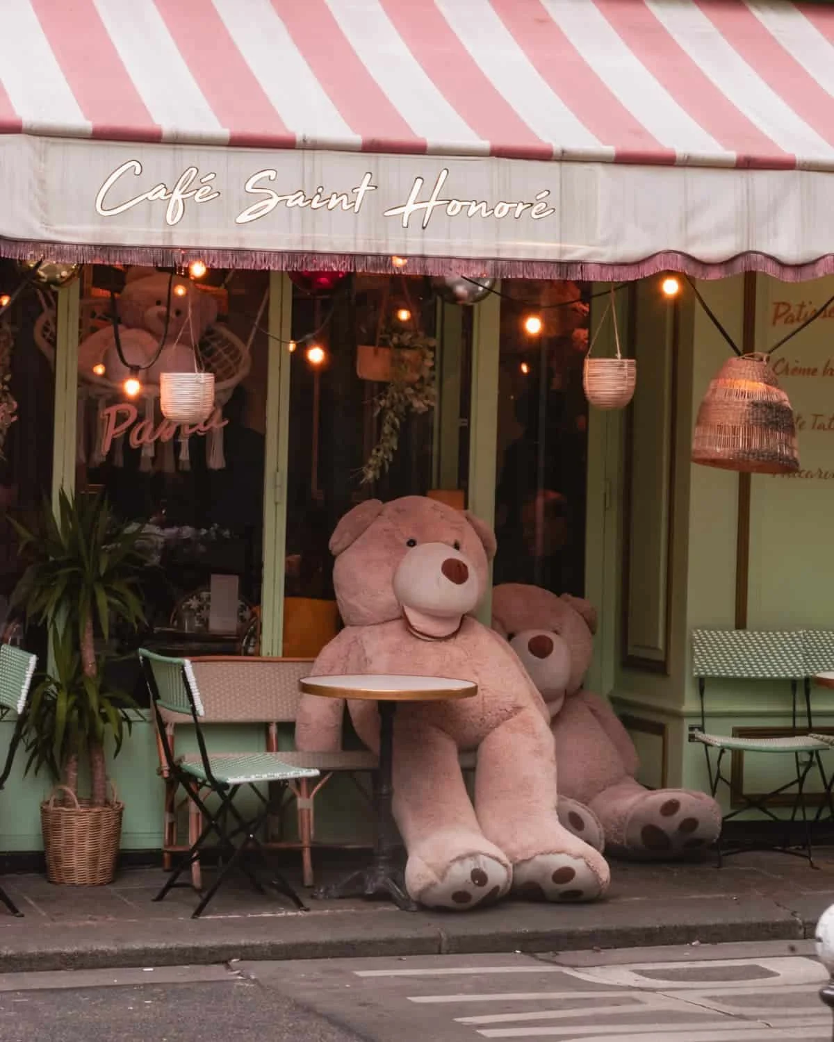 Parisian café in winter with two teddy bears outside