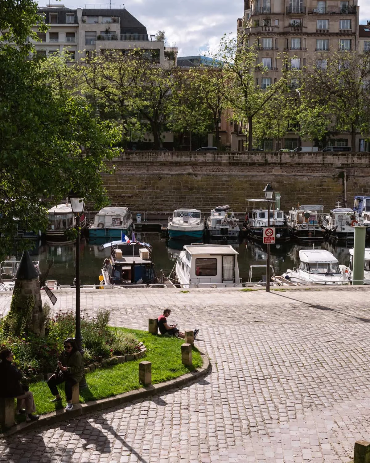 Parisians lounging at Port de l'Arsenal