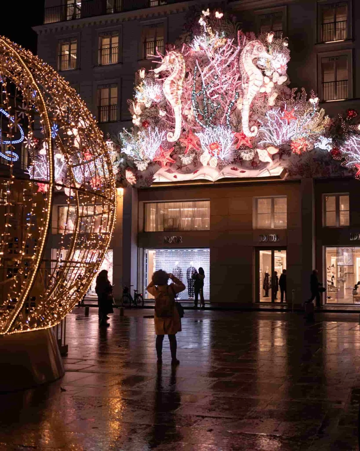 A Paris luxury store decorated with lavish lights for Christmas