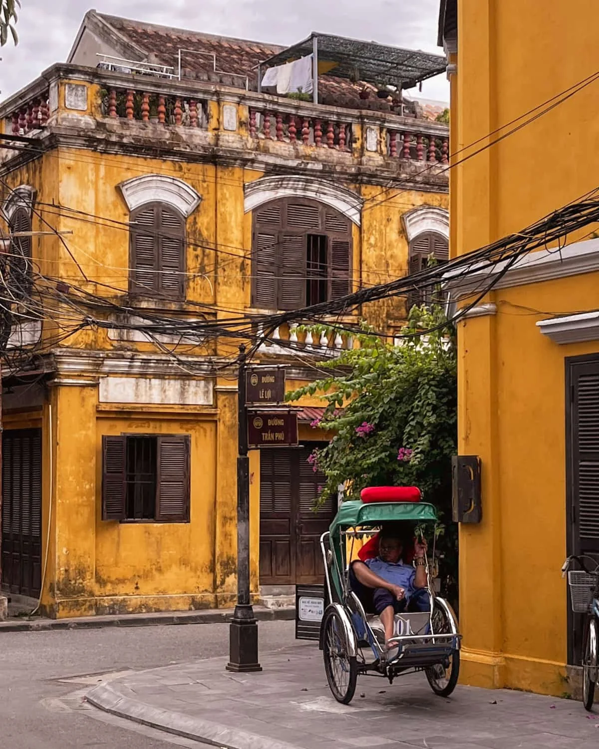 Hoi An Vietnam ancient town with tuktuks