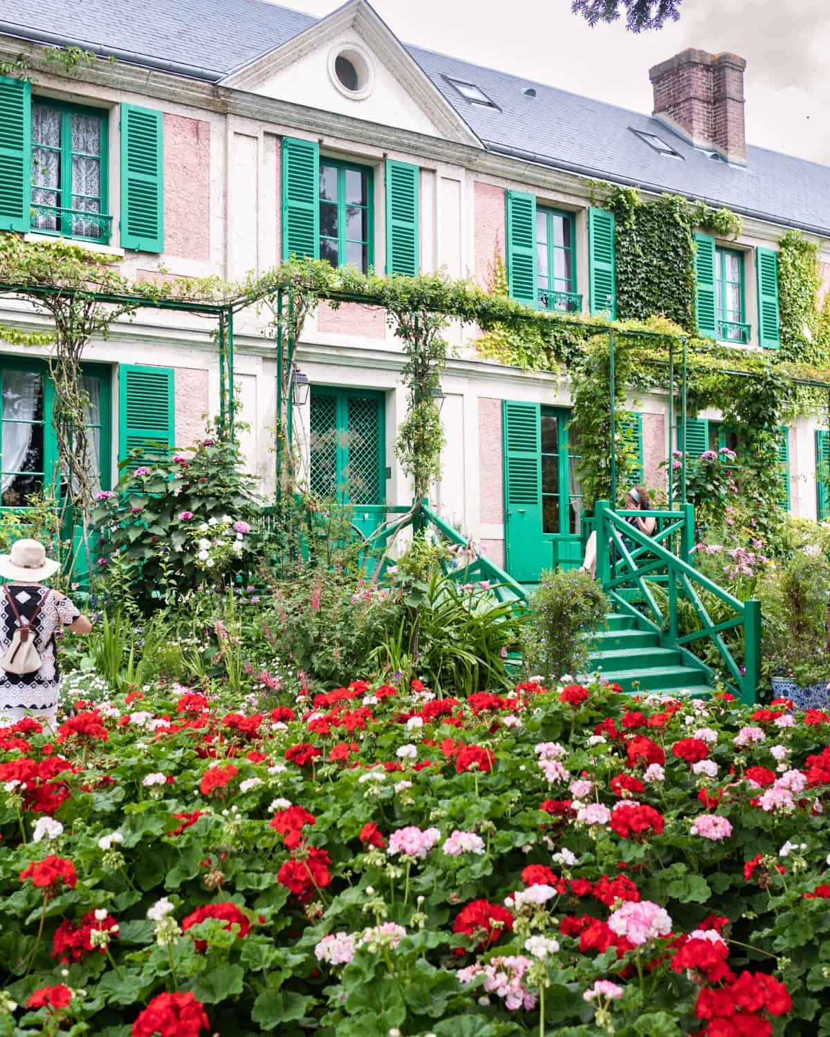 Monet's house in Giverny with a snapshot of blooming flowers in his garden