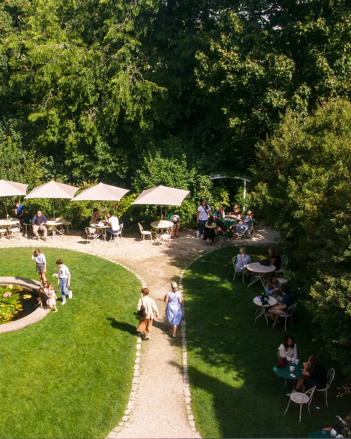 A view of the gardens with café chairs at Café Renoir, Musée de Montmartre Paris