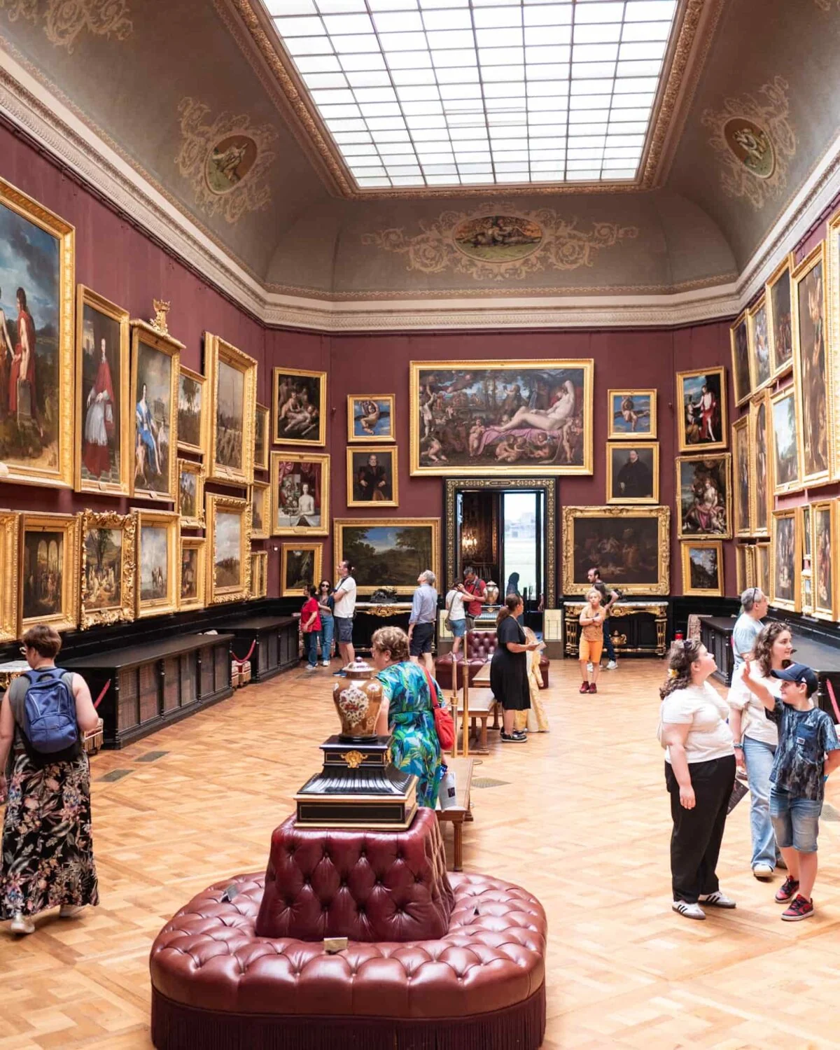 La Galerie des Cerf where people are looking at classic paintings