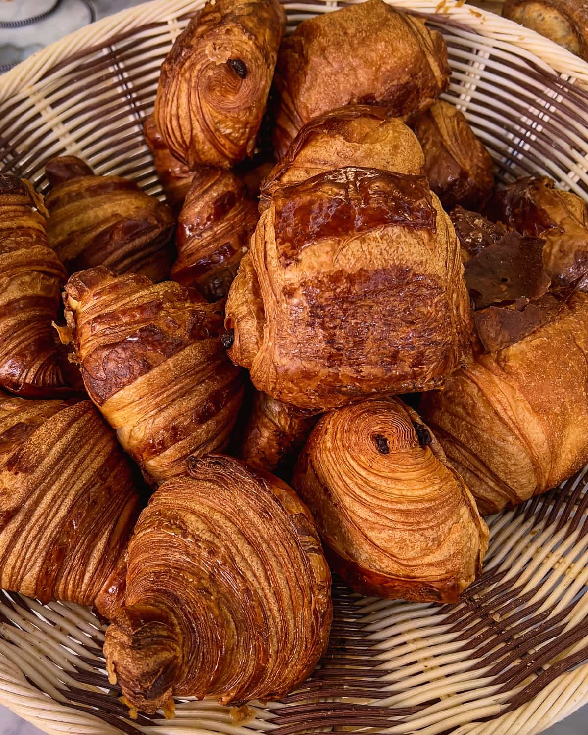 croissants on a basket in a bakery