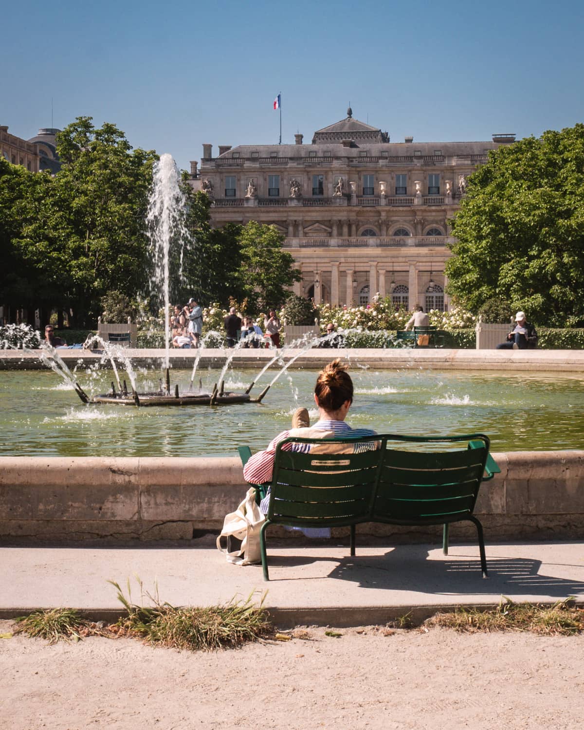 Paris locals at the fountain of jardin du Palais Royal