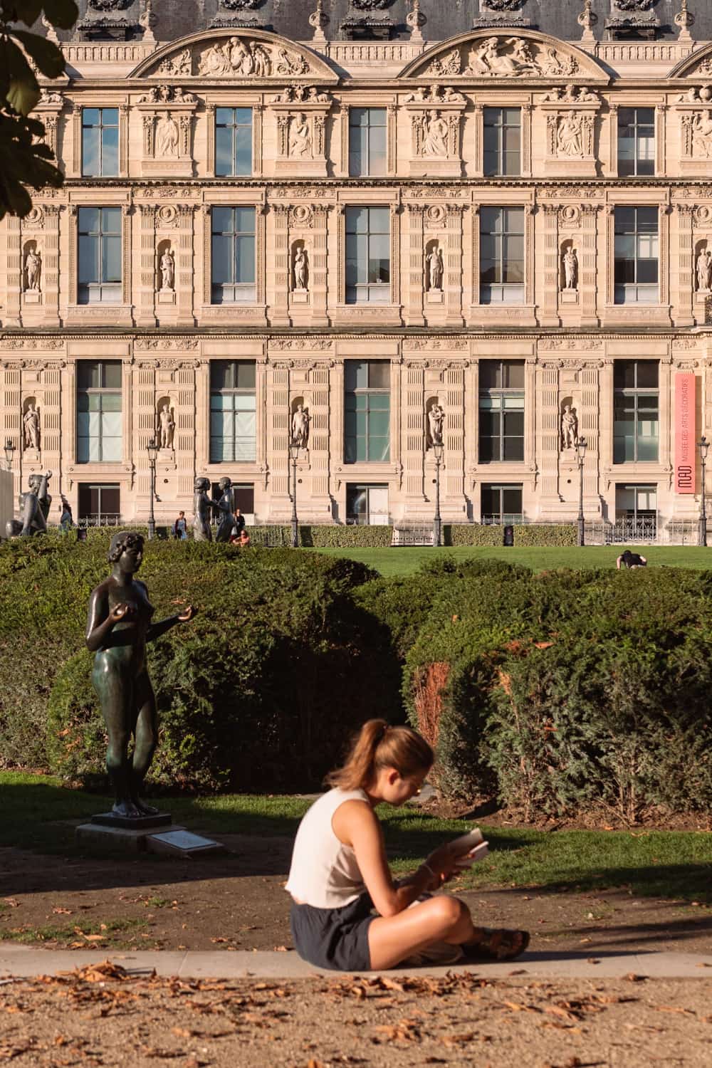 Girl reading a book at Jardin des Tuileries Paris