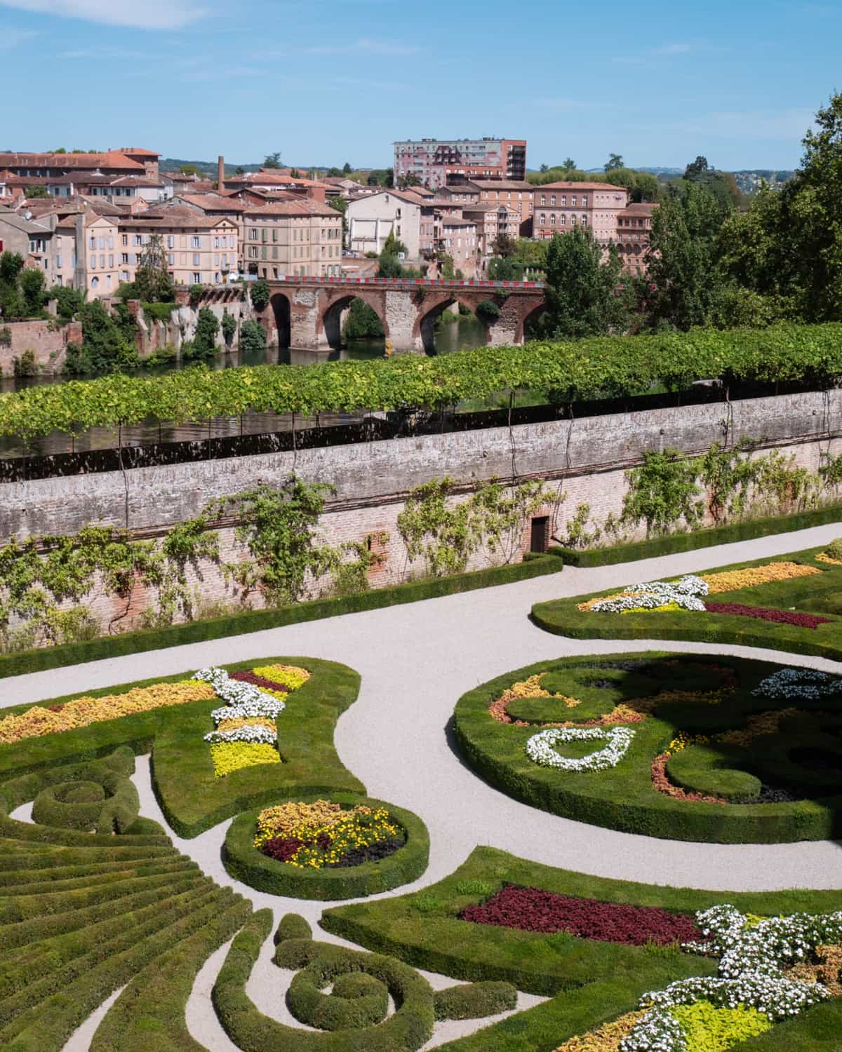 Gardens of Palais de la Berbie, Albi, France with a view of Albi city
