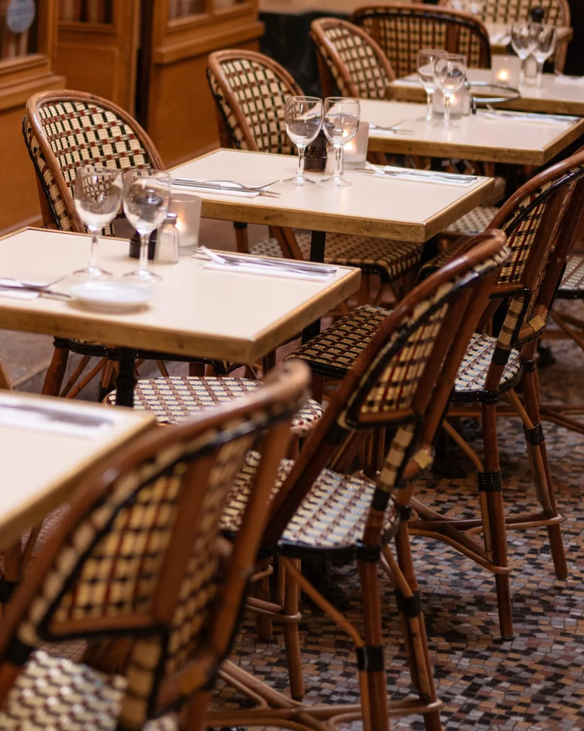 Cafe chairs and dressed tables ready for dinner service